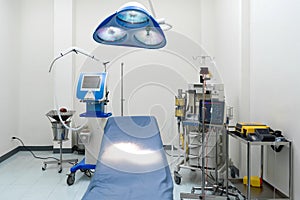 A typical operating room in a hospital with surgical light overhead for providing bright, directional lighting to the surgical