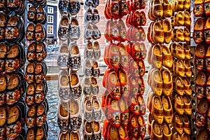 Typical painted wooden shoes in a Dutch souvenir shop in the old city center of Amsterdam