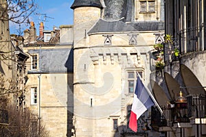 Typical panorama of a narrow street of bordeaux city center, in france, with the Porte Cailhau, a medieval gate