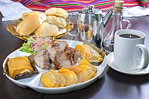 Peruvian food: Chicharrones, tamales, camote frito photo