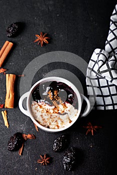 Typical Peruvian dessert: rice pudding and purple mazamorra on a dark background.