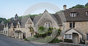 Typical and picturesque English countryside cottages in Castle Combe Village, Cotswolds, Wiltshire, England - UK