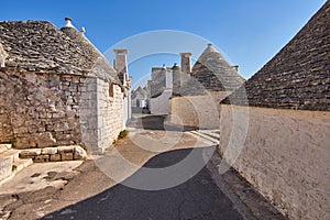 Typical Picturesque Street Displaying The Traditional Trulli houses in Alberobello city, Apulia, Italy