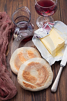 Typical portuguese bread Bolo do Caco with butter and knife