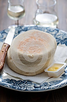 Typical portuguese bread of Madeira Bolo do caco with butter