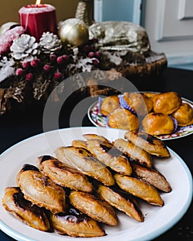 Typical Portuguese Christmas sweets: broa castelar left and beijinhos de ovo right