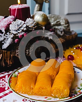Typical Portuguese Christmas sweets: trouxas de ovos, egg yolks and sugar rolls photo
