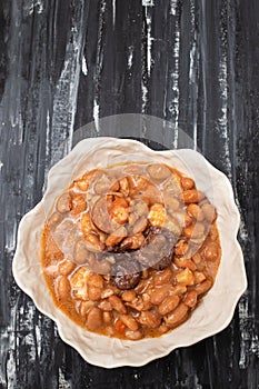 typical portuguese dish with beans and smoked sausages photo