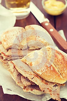 Typical portuguese dish bifanas vendas novas with glass of beer on white plate photo