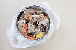 Typical portuguese dish cozido a portuguesa in plastic box take away photo