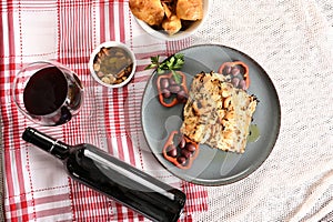 typical portuguese dish roasted codfish with onion garlic peppers and rustic babata lusitanian food