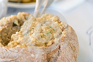A typical Portuguese dish with a thick prawn soup served in bread
