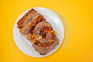 typical portuguese fruit cake Bolo rainha on white plate