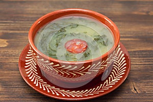 Typical portuguese soup caldo verde in ceramic dish photo