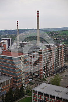 Typical rectangular industrial buildings made of red bricks and vertical windows in the old factory area in Zlin