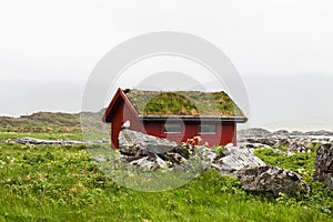 Typical red rorbu fishing hut in village , Lofoten