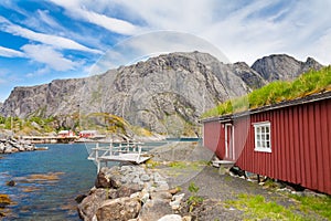 Typical red rorbu fishing hut in village Nusfjord