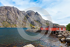 Typical red rorbu fishing hut in village Nusfjord