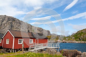 Typical red rorbu fishing hut in village Nusfjord