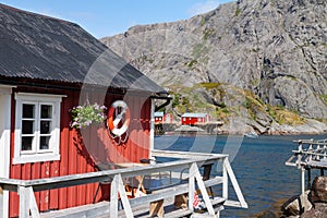 Typical red rorbu fishing hut in village Nusfjord