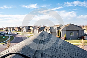 View down the top of an Asphalt shingle roof with ridge cap photo