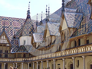 Typical roofs covered with varnished and colors tiles from Burgundy