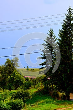 Typical rural landscape and peasant houses in Dealu Frumos, Schoenberg, Transylvania, Romania photo