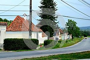 Typical rural landscape and peasant houses in Dealu Frumos, Schoenberg, Transylvania, Romania photo