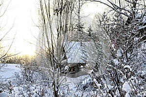 Typical russian abandoned snow-covered village in winter day