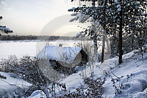 Typical russian abandoned snow-covered village in winter day