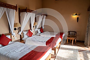 Typical safari lodge room, with three twin beds, in Kenya Africa