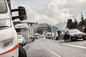 Typical scene on European highways during summer holiadays rush hour. A traffic jam with rows of cars tue to highway car