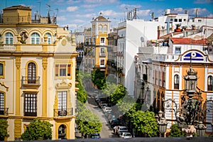 Typical Seville street, sunshine and blue sky