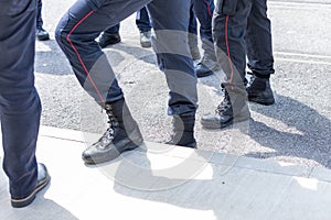 Typical shoes of italian carabinieri police officers. Leather shoes on feet of police unit in italy.. Police shoewear photo