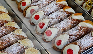 typical Sicilian dessert from southern Italy called CANNOLO SICILIANO filled with ricotta cheese candied cherry