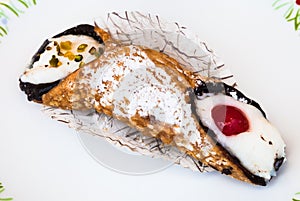 Typical sicilian pastry Cannoli on plate