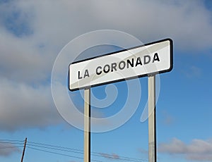 Spanish end of City signpost - La Coronada photo
