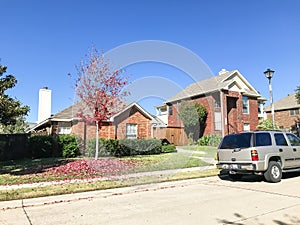 Typical single family home in Texas, America with bright red col