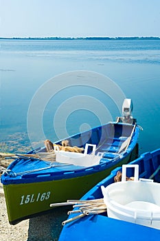 Typical small boats for fishing in the Orbetello lagoon in the grosseto area in Tuscany Italy