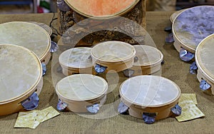 Typical small handmade Salento tambourines for sale on a stall during a festival