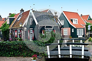 Typical small houses and bridge in Volendam, Holland photo