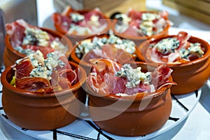 Typical snack of Basque Country and Navarre, pinchos or pinxtos served in bar, San Sebastian, Spain