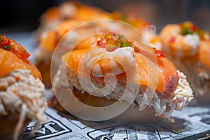 Typical snack of Basque Country and Navarre, pinchos or pinxtos served in bar, small slices of bread upon which ingredient or