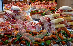 Typical snack of Basque Country and Navarre, pinchos or pinxtos, small piece of bread with different toppings, served in bar,