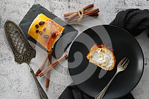 Typical spanish dessert: Brazo de gitano. Cream and raisins swiss roll photo