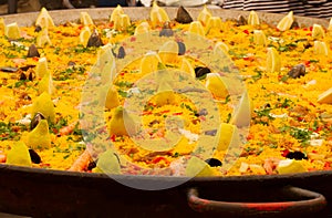 Typical Spanish paella in big pan, street market