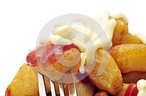 Typical spanish patatas bravas, fried potatoes with a hot sauce photo