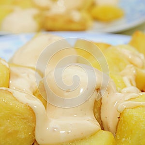 Typical spanish patatas bravas, spicy potatoes photo