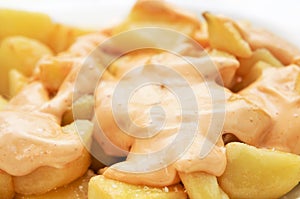 Typical spanish patatas bravas, spicy potatoes photo