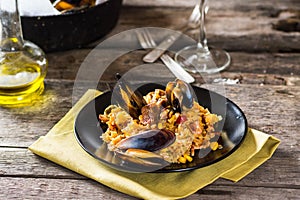 Typical spanish seafood paella in traditional pan. Spanish food. Valencian dish. Rice with seafood.